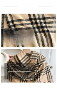 Detailed macro view of the soft beige and black plaid texture of the knitted scarf