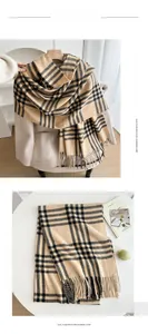 Detailed view of khaki and black plaid imitation cashmere scarf with long tassels