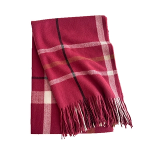 Classic red plaid scarf with tassels made of warm double-sided cashmere-like fabric