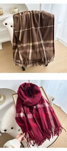 Detail of thick plaid scarves with soft fringes in brown beige and red pink patterns