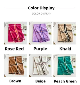 Classic plaid cashmere-like scarves in six colors with long tassels displayed on a table