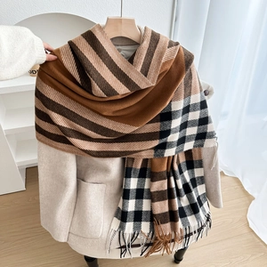 Plaid tassel shawl in brown and beige colors styled with a winter coat