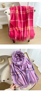 Detail view of pink and lavender plaid cashmere-feel scarves with soft fringe edges