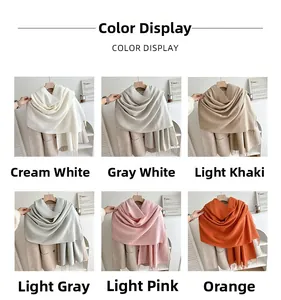 Color display of thick tassel scarves in cream, khaki, grey, pink, and orange