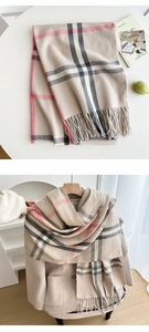 Close-up of classic check pattern scarf with elegant fringe details and soft texture