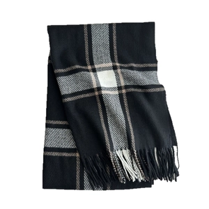 Classic black and white checkered scarf with soft cashmere feel and fringe detail