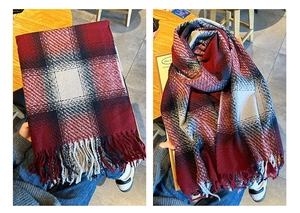 Detailed view of soft thick checkered scarf with long tassels in red and black
