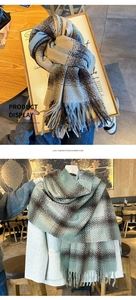 Detail shot of thick imitation cashmere plaid scarves with soft fringe and fiber texture