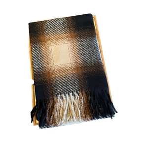 Classic thick plaid tassel scarf in dark brown and black pattern on white background
