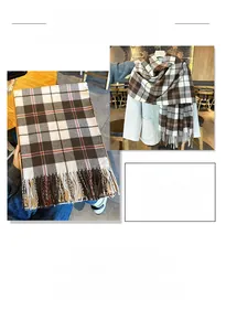 Detailansicht eines dicken karierten Schals mit Fransen und weicher Wintertextur