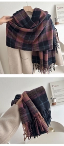 Detail of thick plaid scarf with long tassels showing rich purple and brown texture
