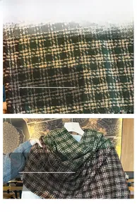 Macro texture of green and brown checkered scarf showing fine stitching and soft fabric