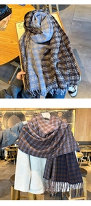 Detail of vintage checkered scarves with fringe edges in soft wool blend fabric