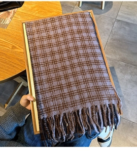 Detail shot of lilac and brown checkered knit scarf with soft tassel fringe finish