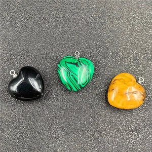 Three heart-shaped natural stone pendants in onyx, malachite and tiger eye with silver loops