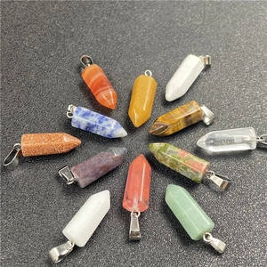 Detailed arrangement of 11 hexagonal natural stone crystal pendants with silver metal clasps
