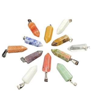 Radial display of hexagonal crystal column pendants in various natural stones with silver bails
