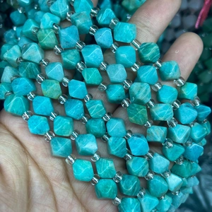 Close-up of faceted turquoise amazonite cube stone beads for DIY jewelry making