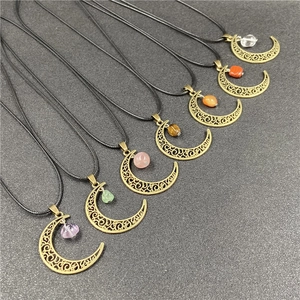Antique bronze crescent moon pendants with various semi-precious stones on black cords