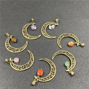 Detailed view of seven bronze hollow moon pendants with various natural gemstones