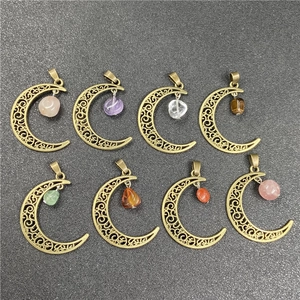 Detailed filigree copper moon pendants with various assorted semi-precious gemstones