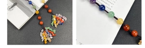 Detailed macro of handmade seven-color natural crystal bead ornament with woven cord
