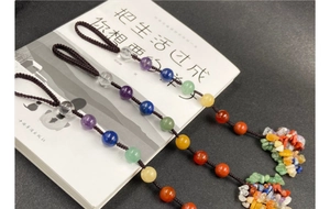 Handmade woven pendant featuring colorful natural crystal beads and semi-precious stones