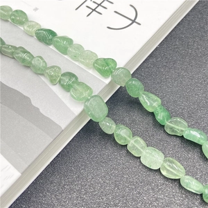 Detailed view of natural irregular green aventurine beads for DIY jewelry making