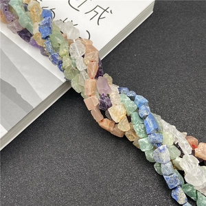 Assorted natural semi-precious stone chips including amethyst and lapis lazuli for DIY jewelry