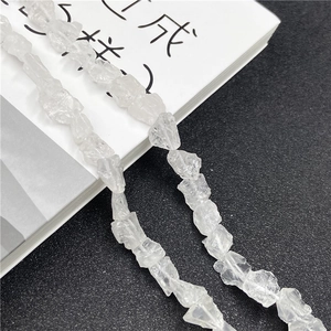 Macro shot of irregular natural clear quartz stone beads with high transparency for DIY