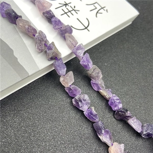 Macro shot of irregular natural amethyst raw stone beads for DIY jewelry making