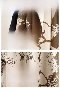 Detail showing the creamy white and brown abstract ink pattern on cashmere-like scarf