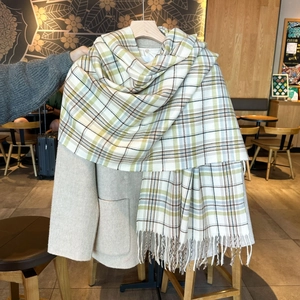 Women's autumn winter plaid scarf with fringe in grass green, yellow, and blue grid pattern