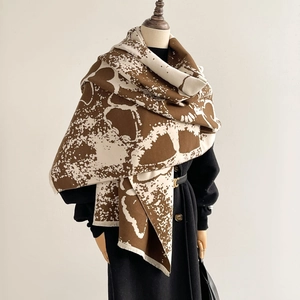 Winter faux cashmere scarf with brown abstract butterfly patterns and soft tassels