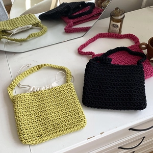 Handmade woven cotton rope tote bags in green, black, and rose red with drawstring lining