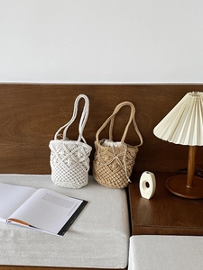 Detail of bohemian hollow straw tote bag featuring cotton drawstring lining and hand-woven design