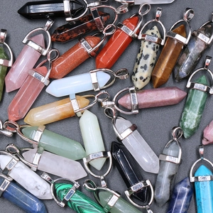 Multiple natural crystal hexagonal bullet pendants including rose quartz and tiger eye