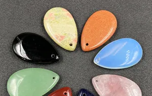 Polished teardrop stone pendants in rose quartz and various crystals with pre-drilled holes