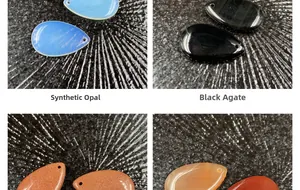 Polished teardrop gemstone pendants in opalite, black onyx, and goldstone varieties
