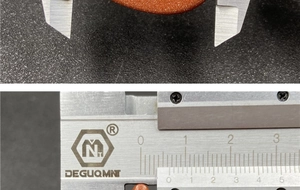 Macro shot measuring orange goldstone bead diameter with a digital caliper tool