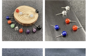 Detailansicht verschiedener Ohrstecker aus Halbedelsteinen auf dunklem Hintergrund