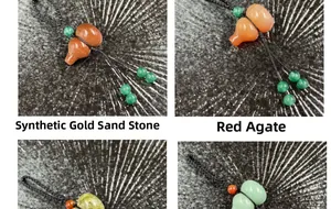 Detailed view of woven gourd keychains in gold sandstone and red agate varieties