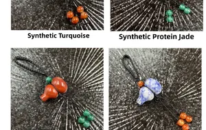 Detail of synthetic turquoise and opal gourd pendants with black woven cord strings