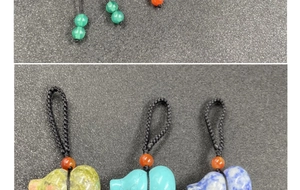 Detail of hand-carved natural gemstone elephant pendant with black woven lanyard cord