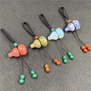 Set of four natural crystal agate gourd keychains with woven cords in assorted colors