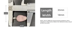 Detail showing pink quartz skull pendant dimensions measured at 35mm by 18mm