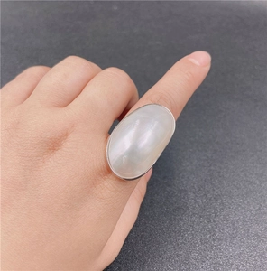 French style minimalist silver ring featuring a large oval white mother of pearl stone