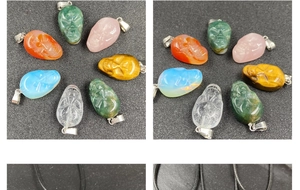 Detailed set of skull-shaped semi-precious stone pendants with silver clasps and cords