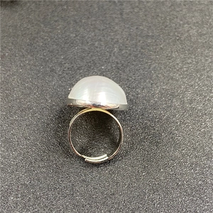 Macro shot of silver adjustable ring featuring a large translucent mabe pearl stone