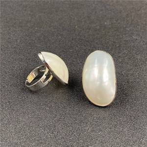 Minimalist silver open ring set with large oval white iridescent mother of pearl stones